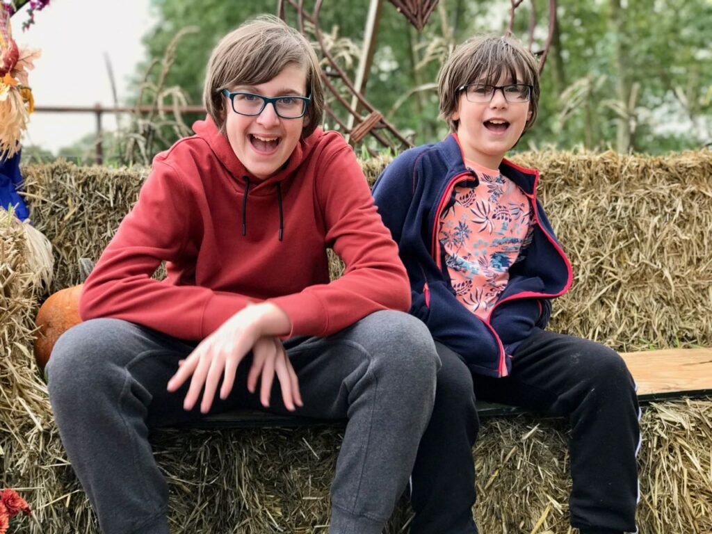 two-boys-pumpkin-picking-farm