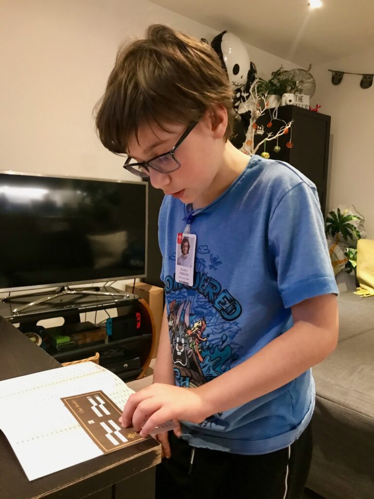 Boy playing Trapped Escape Room game