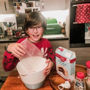 Baking in Christmas Lockdown Boy baking Christmas cupcakes